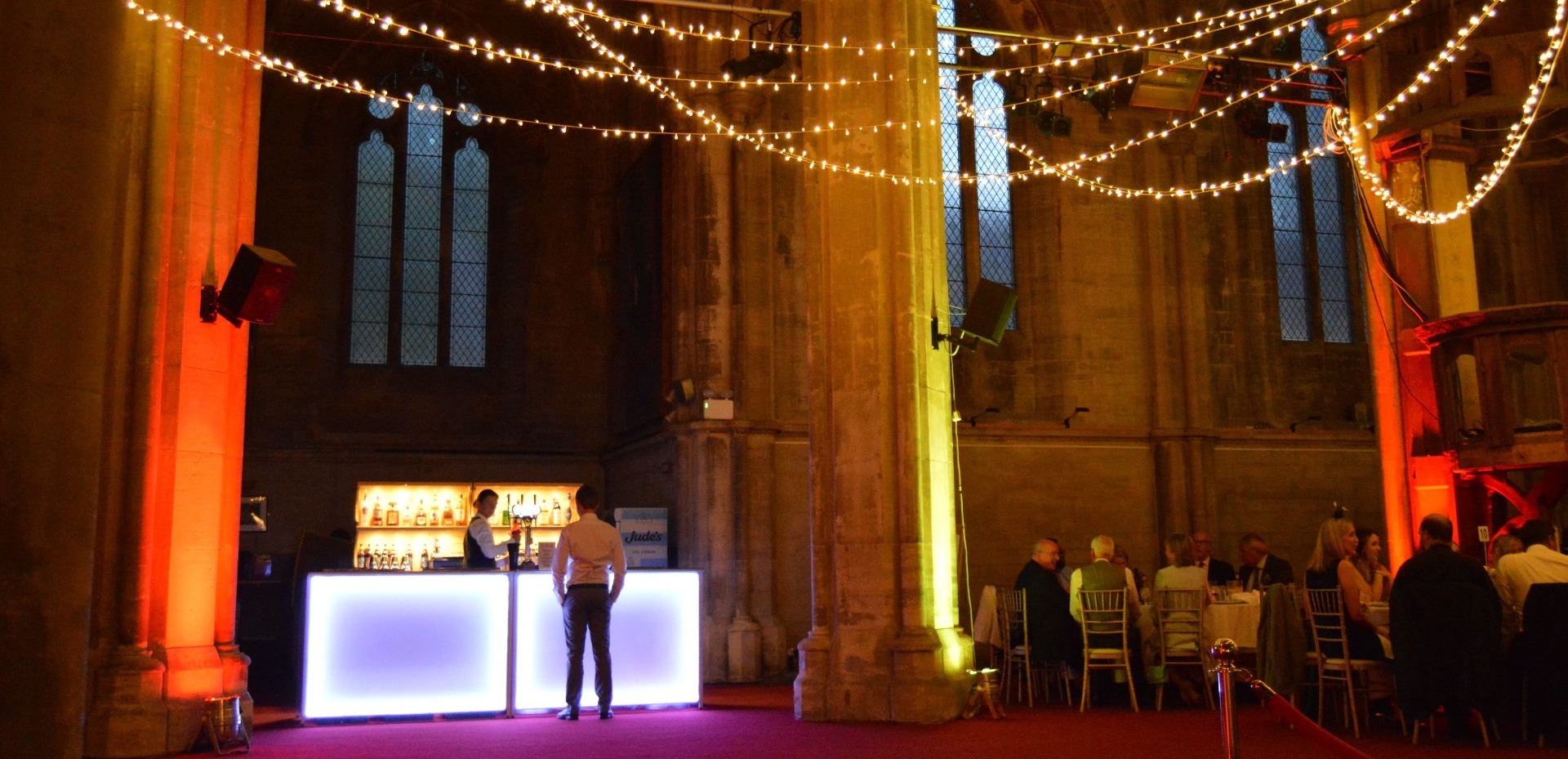 Mobile bar with LED lighting serving drinks at a wedding