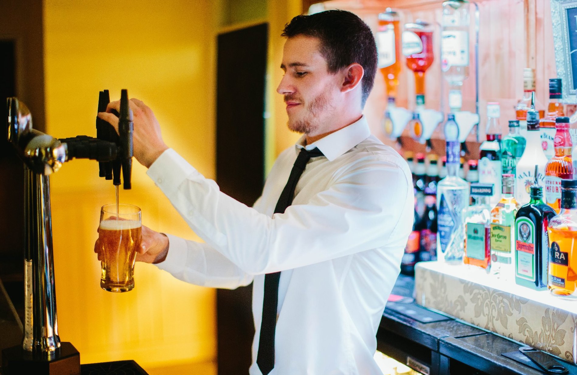 Bartender pouring a pint of beer